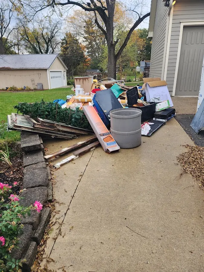 Dumpster being loaded with debris for Demolition Dumpster Rental in Martinsville